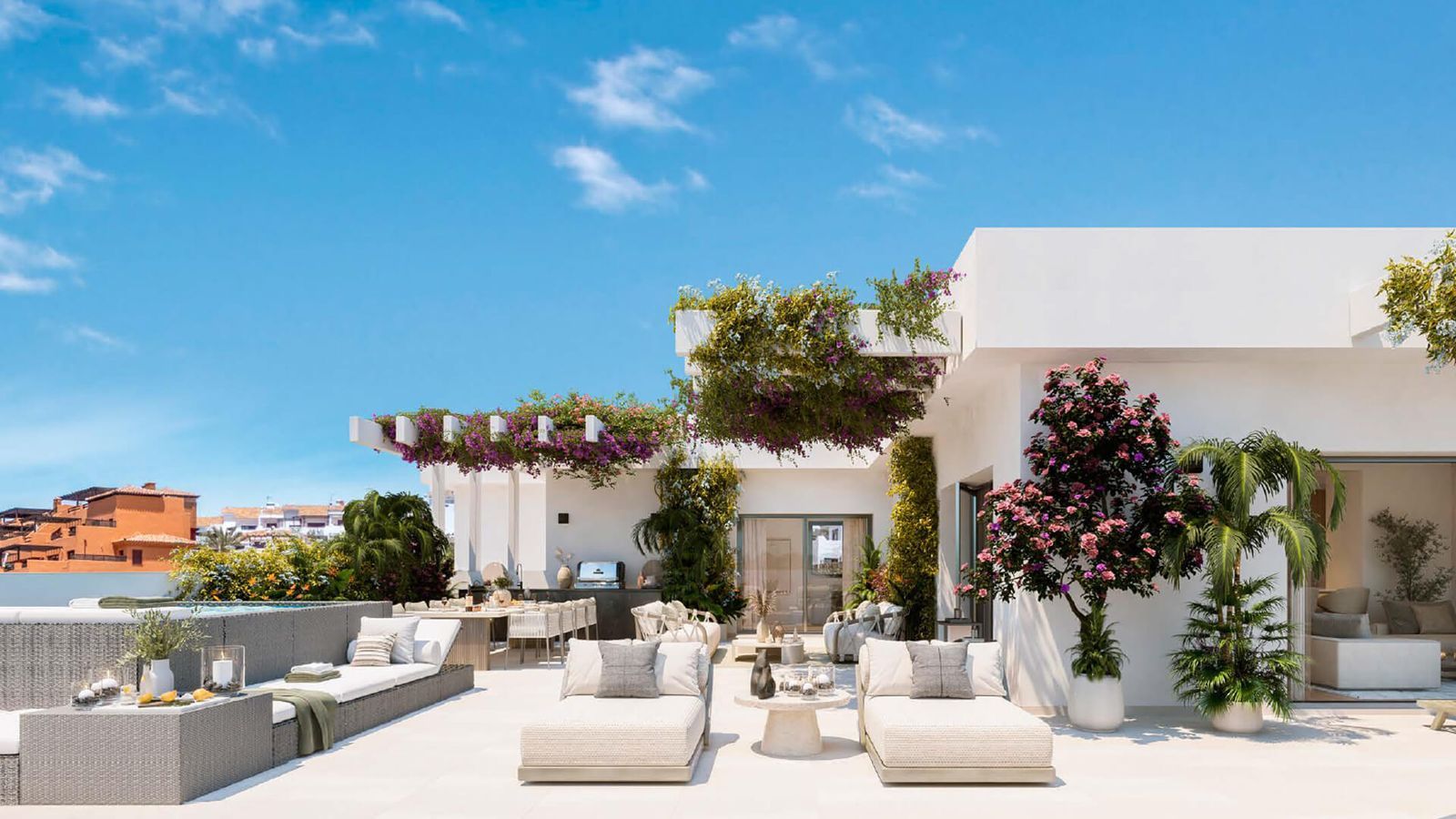 Luxe dakterras met buitenmeubilair, planten en uitzicht op de omgeving.